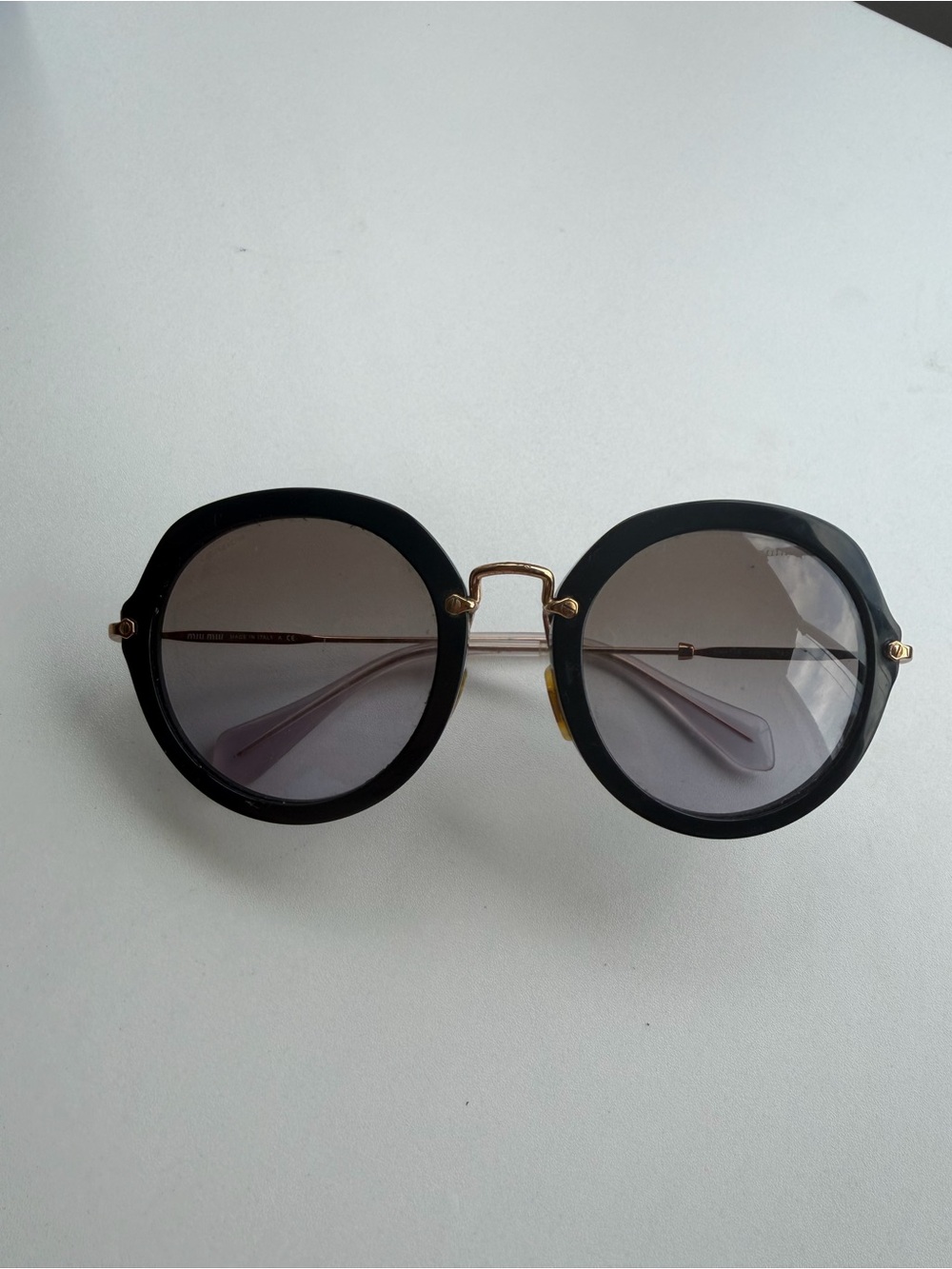 Miu Miu Women's Black Round Sunglasses with Gold Bridge